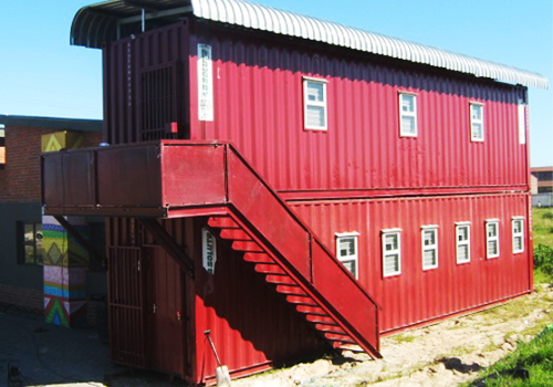 Shipping containers converted into housing, stacked on top of one another