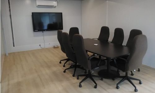 Boardroom with wooden flooring in container conversion