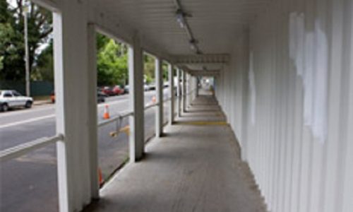 Shipping containers converted for safe construction walkway (tunnel)