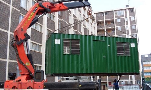 6m basic office being positioned by crane-truck